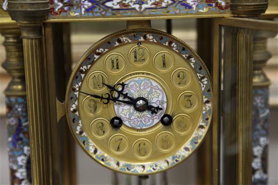 An early 20th century French ormolu and champleve enamel clock garniture, clock 14.5in.